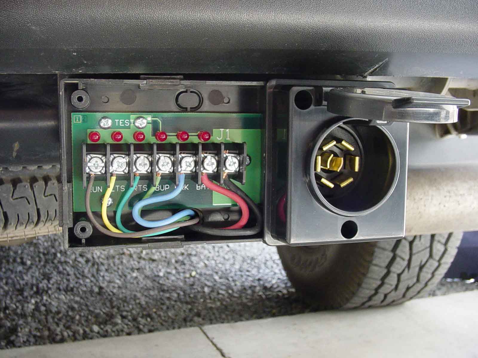 Mounted Pro Plug trailer connector with the cover removed. Shows wiring of this Surface mountable 7 pin trailer plug connector.